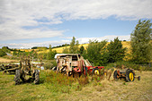 Old tractors on farmland in Wiltshire, England, UK